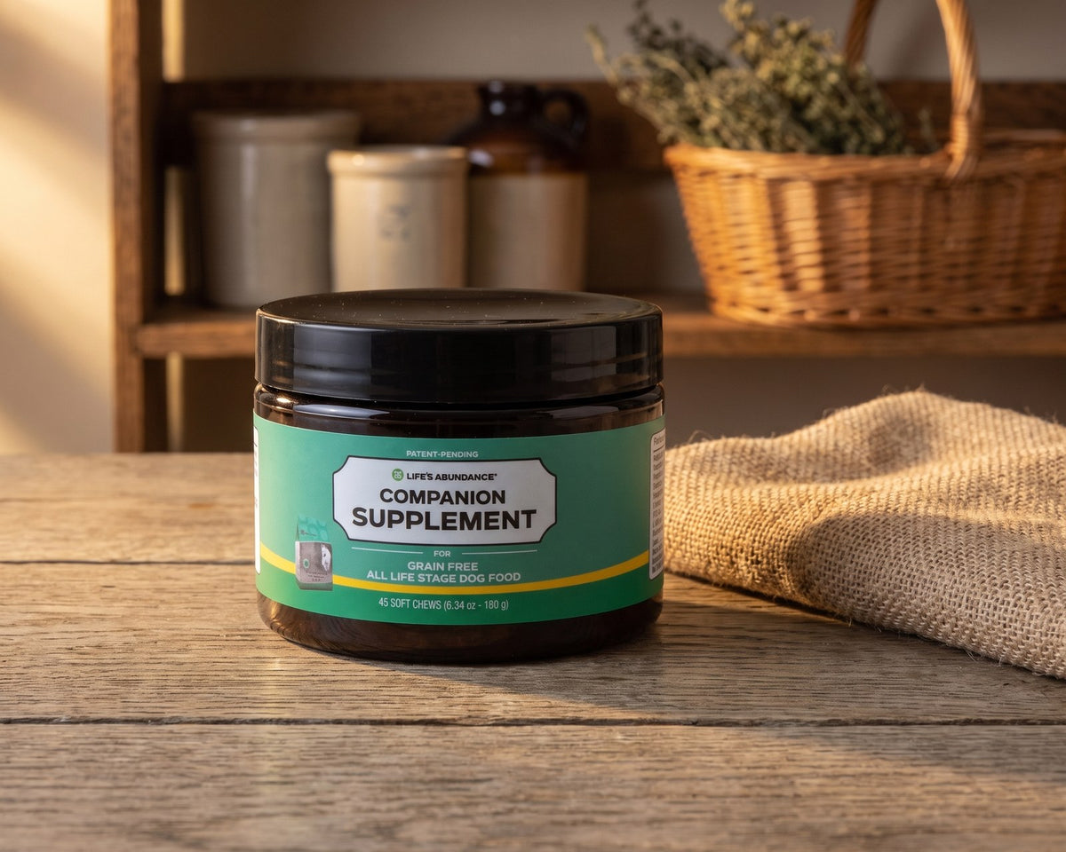 Companion Supplement for Grain-Free All Life Stage Dog Food jar on a rustic oak table beside a burlap cloth