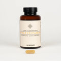 Multivitamin 60-capsule amber bottle with one capsule in front on a plain white background