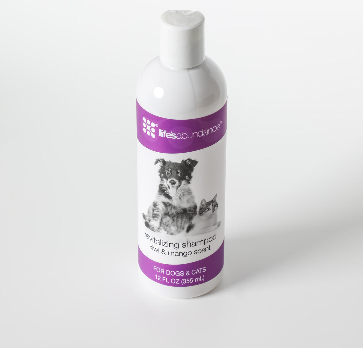 Revitalizing Shampoo 12 oz bottle photographed at an angle on a white studio background
