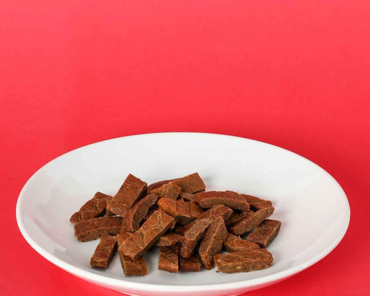 Tasty Rewards treats on a white plate on a red background